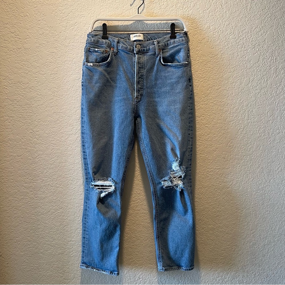 AGOLDE, (altered)  “Riley” blue stonewashed distressed button fly jeans
